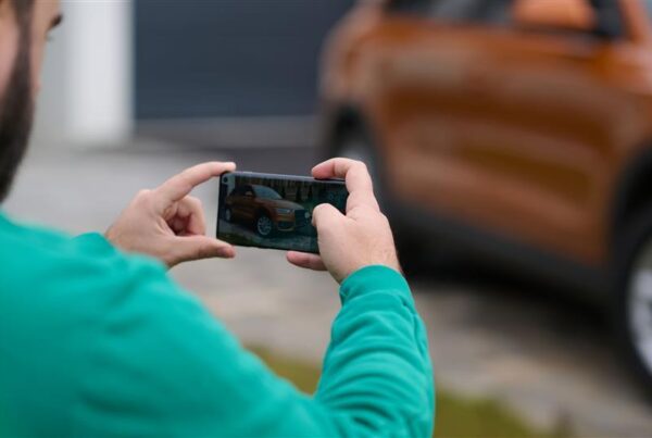 A customer taking an image of their vehicle